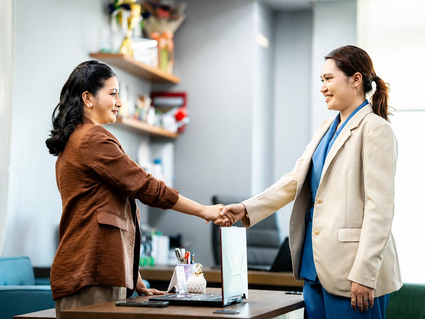 A professional handshake during an office meeting