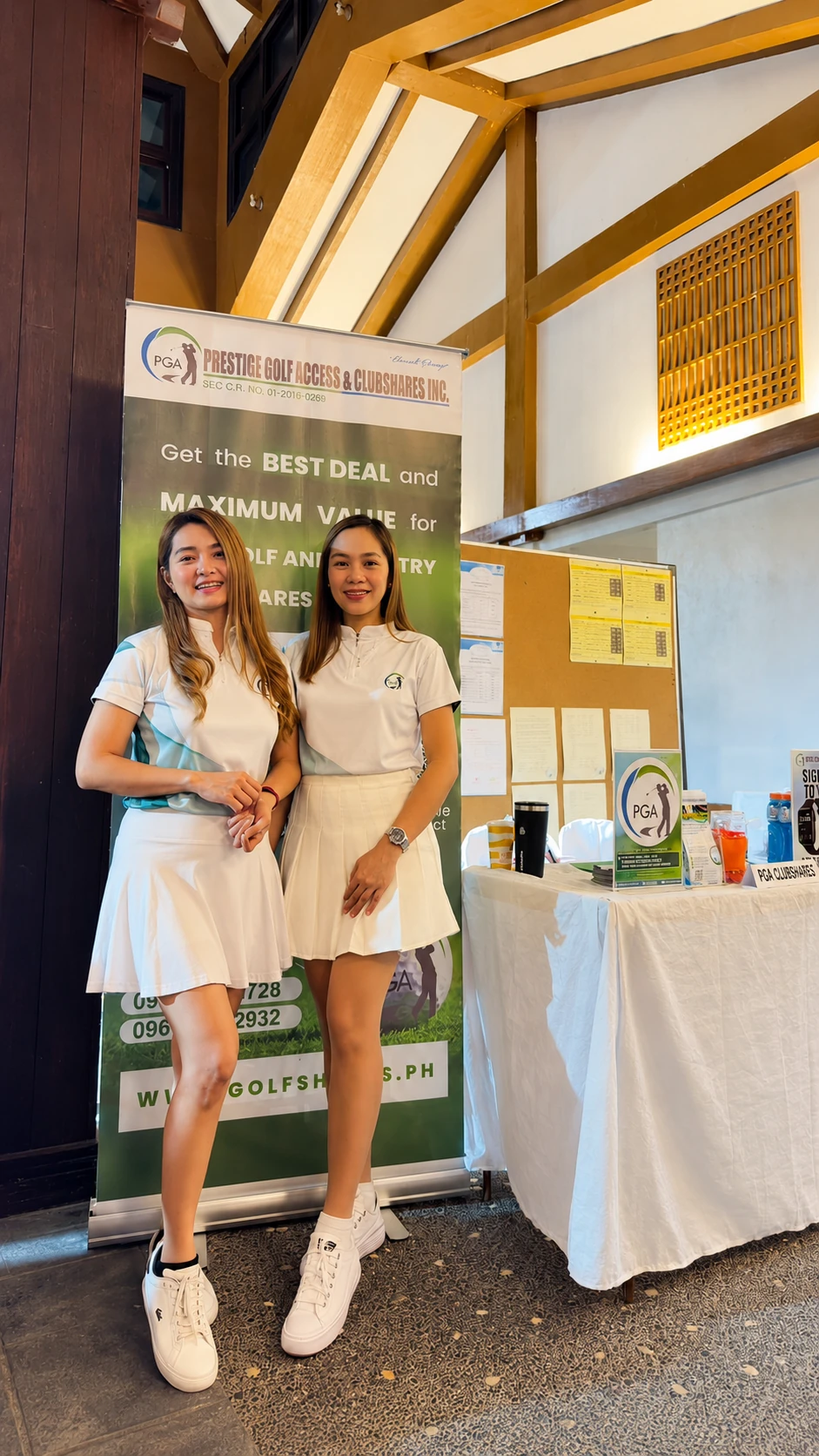 PGA representatives at a golf event booth